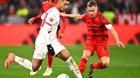 Zurück in der Bundesliga: Ausgerechnet gegen die Bayern könnte Benjamin Henrichs (l) wieder im Leipzig-Kader stehen (Archivbild) / Foto: Tom Weller/dpa