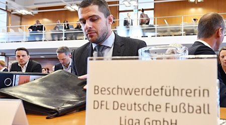 Marc Lenz, Geschäftsführer der Deutschen Fußball Liga (DFL), sitzt im Bundesverfassungsgericht. / Foto: Uli Deck/dpa