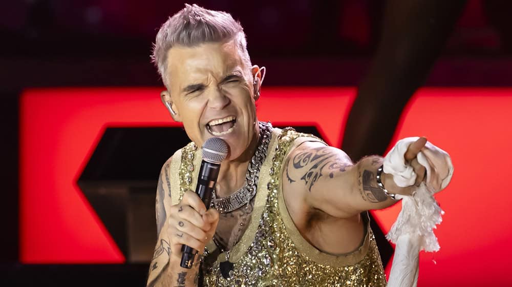 Sieben Auftritte in Deutschland: Für die Konzerte von Superstar Robbie Williams beginnt der Vorverkauf. (Archivbild) / Foto: Michael Buholzer/Keystone/dpa