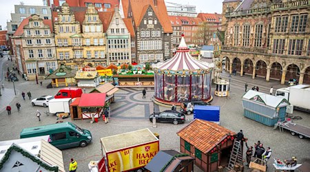 Zum Weihnachtsmarkt in Bremen kommen jährlich zahlreiche Besucherinnen und Besucher. (Archivbild) / Foto: Sina Schuldt/dpa