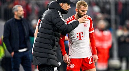 Trainer Thomas Tuchel von München (l) gibt Konrad Laimer taktische Anweisungen mit. / Foto: Tom Weller/dpa