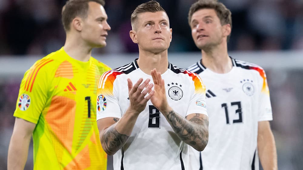 Die 2014-Weltmeister Manuel Neuer (l), Toni Kroos (M) und Thomas Müller (r) werden in München verabschiedet. / Foto: Sven Hoppe/dpa