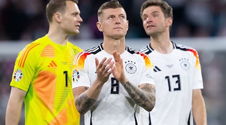 Die 2014-Weltmeister Manuel Neuer (l), Toni Kroos (M) und Thomas Müller (r) werden in München verabschiedet. / Foto: Sven Hoppe/dpa