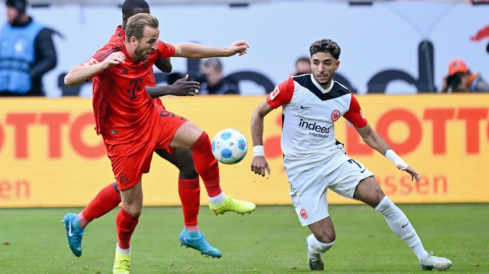 Harry Kane (l) blieb auch im Topspiel gegen Eintracht Frankfurt ohne Treffer. / Foto: Uwe Anspach/dpa