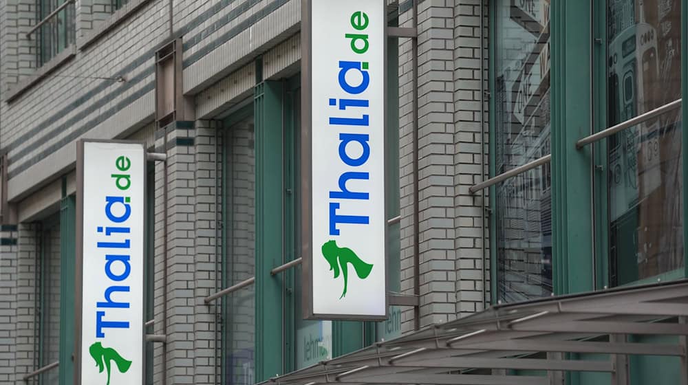 Das Thalia-Logo an einer Filiale der Buchhandelskette. / Foto: Marcus Brandt/dpa