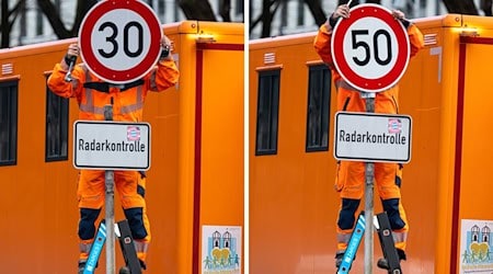 Die Mitarbeiter des Baureferats haben inzwischen eine gewisse Routine beim Schildwechsel an der Landshuter Allee. (Archivbild) / Foto: Peter Kneffel/dpa