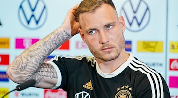 Der deutsche Nationalspieler David Raum gestikuliert. / Foto: Uwe Anspach/dpa