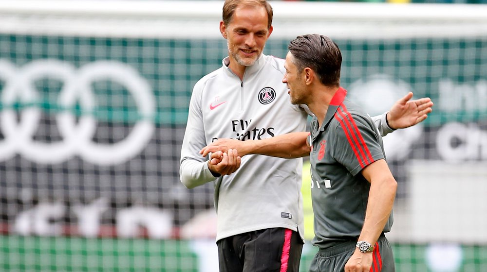 Thomas Tuchel (i), entrenador del PSG, y Niko Kovac, entrenador del FC Bayern de Múnich, se despiden tras el partido / Foto: Erwin Scheriau/dpa/Archivbild