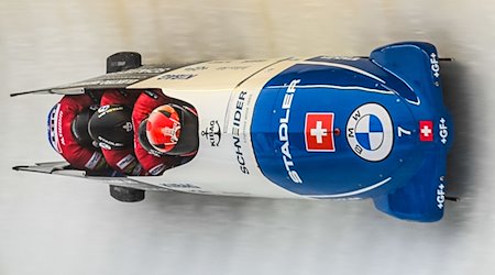 Michael Vogt, Cyril Bieri, Alain Knuser and Sandro Michel from Switzerland race down the track. The bobsleigh last crashed in Altenberg / Photo: Robert Michael/dpa