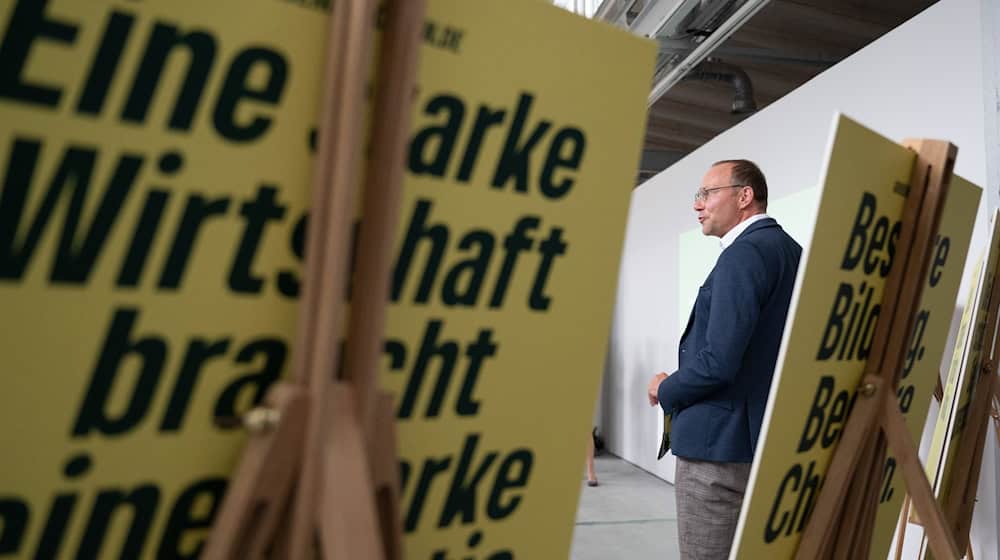 Wolfram Günther (Bündnis90/Die Grünen), Saxony's Environment Minister, stands behind numerous election posters during his party's campaign presentation for the 2024 state election / Photo: Sebastian Kahnert/dpa