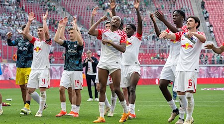 Leipzigs Mannschaft jubelt nach einem Spiel. / Foto: Hendrik Schmidt/dpa/Archivbild