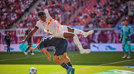 Leipzig defender Castello Lukeba (above) will have to do without his teammate Willi Orban for the next few games. / Photo: Jan Woitas/dpa