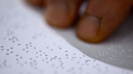 Braille enables blind and visually impaired people to read and write with their fingers. / Photo: Hendrik Schmidt/dpa