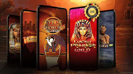 Moderne Spielbank-Slots auf Smartphones vor antiker Kulisse bei Sonnenuntergang