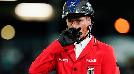 Betrauert sein Pferd D'Aganix: Christian Ahlmann. (Archivbild) / Foto: Uwe Anspach/dpa