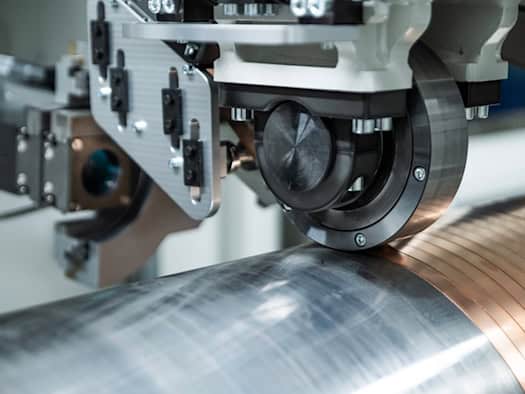 Coiled in a spiral, joined by laser: The Dresden process coats metal parts faster and more energy-efficiently than previous methods.