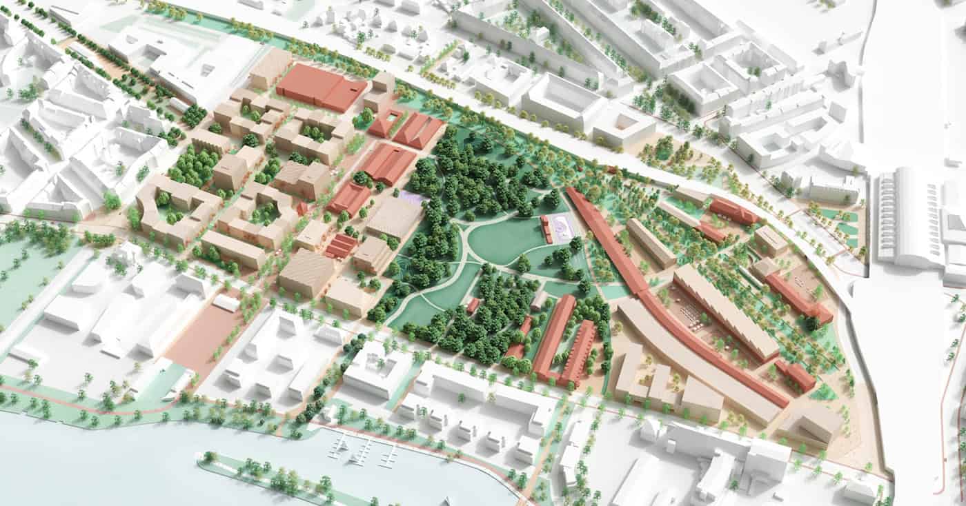 Dresden: Überarbeiteter Entwurf für das Quartier Alter Leipziger Bahnhof (Stand 2026) Detailliertes städtebauliches 3D-Modell des geplanten Quartiers am Alten Leipziger Bahnhof in Dresden. Zu sehen sind helle Wohngebäude mit begrünten Höfen im Westen, ein großer zentraler Park mit Baumbestand sowie rote Bestands- und Kulturgebäude im Osten.