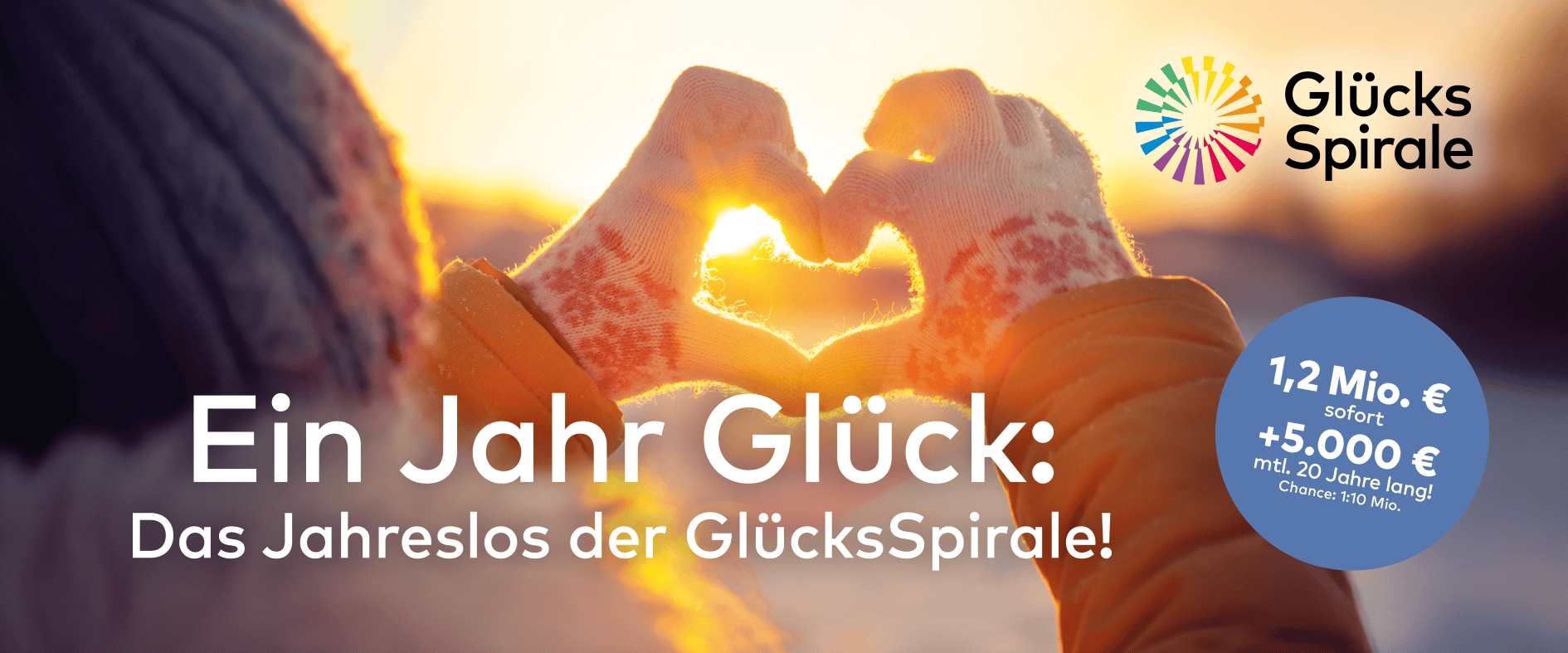 Zwei Hände in Winterhandschuhen formen ein Herz vor untergehender Sonne, darüber steht „Ein Jahr Glück: Das Jahreslos der GlücksSpirale!“, mit Hinweis auf 1,2 Mio. € Sofortgewinn und 5.000 € monatlich.