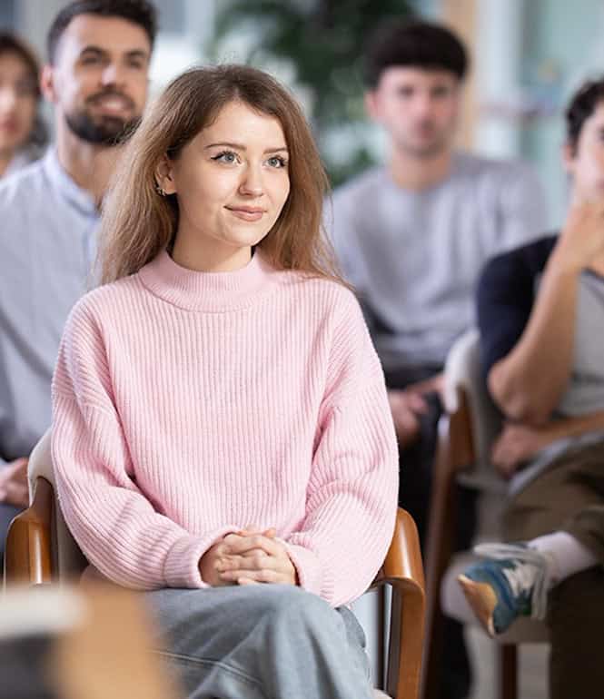 Zuhörende in einem Workshop zu mentaler Stärke und Lebenszufriedenheit