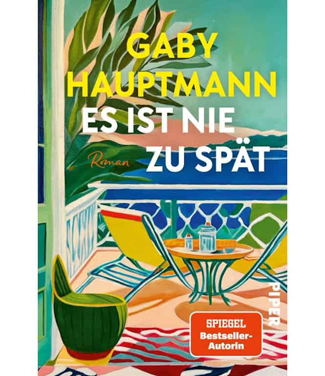 Buchcover von „Es ist nie zu spät“ von Gaby Hauptmann mit farbenfroher Terrasse und Meerblick
